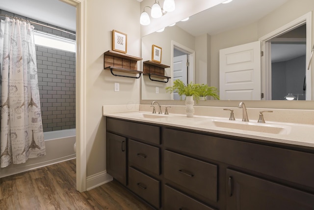 829 Pathlow Dr, Pickerington, OH 43147 - full bath with double vanity, wood finished floors, and shower / bathtub combination with curtain