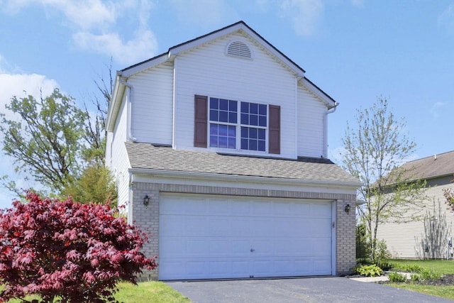 1993 Schrive Dr, Hilliard, OH 43026 - traditional-style home with a garage, brick siding, roof with shingles, and driveway