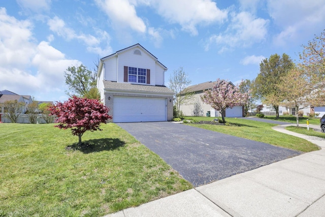 1993 Schrive Dr, Hilliard, OH 43026 - traditional home featuring an attached garage, asphalt driveway, and a front yard
