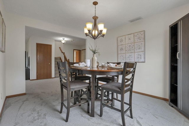 1993 Schrive Dr, Hilliard, OH 43026 - dining room with light carpet, a chandelier, baseboards, and stairway
