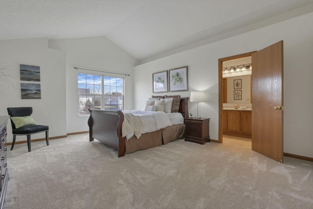 1993 Schrive Dr, Hilliard, OH 43026 - bedroom featuring light carpet, vaulted ceiling, ensuite bath, and baseboards