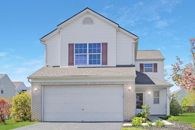 1993 Schrive Dr, Hilliard, OH 43026 - traditional-style home with a garage, concrete driveway, roof with shingles, and brick siding