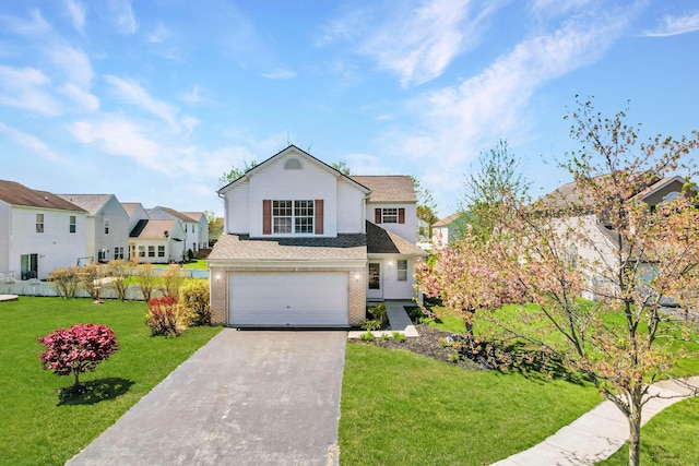 1993 Schrive Dr, Hilliard, OH 43026 - traditional-style house featuring a garage, concrete driveway, a front yard, brick siding, and a residential view