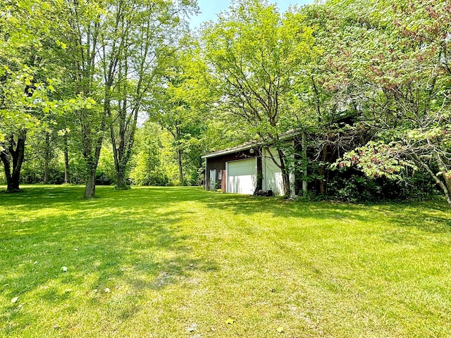 5401 Plantation Rd, Sunbury, OH 43074 - view of green lawn with a detached garage and an outdoor structure