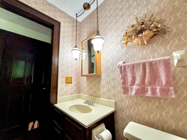 5401 Plantation Rd, Sunbury, OH 43074 - bathroom featuring wallpapered walls, toilet, and vanity