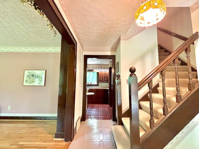 5401 Plantation Rd, Sunbury, OH 43074 - stairway featuring a textured ceiling and baseboards