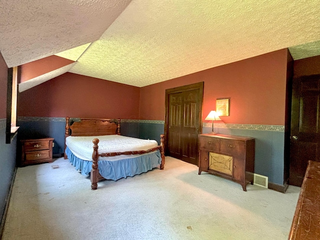 5401 Plantation Rd, Sunbury, OH 43074 - bedroom with a textured ceiling, carpet flooring, a wainscoted wall, and lofted ceiling