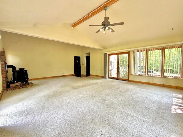5401 Plantation Rd, Sunbury, OH 43074 - unfurnished living room with a wood stove, ceiling fan, carpet, and baseboards