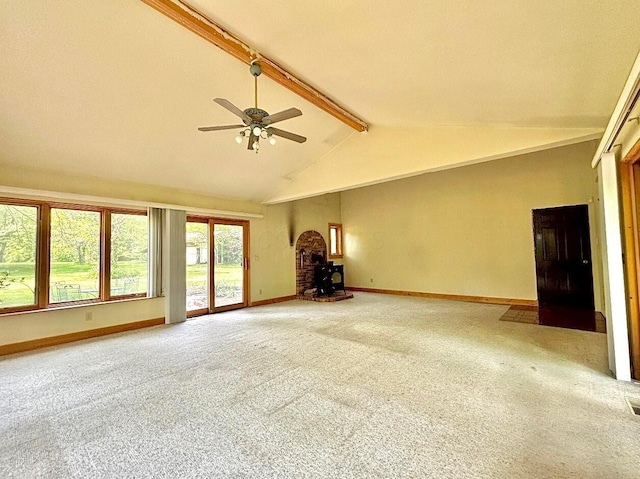 5401 Plantation Rd, Sunbury, OH 43074 - unfurnished living room featuring a wood stove, beam ceiling, light colored carpet, baseboards, and a ceiling fan