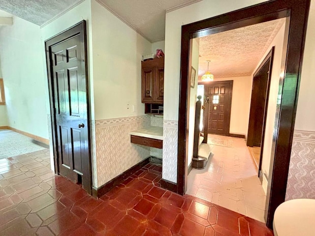 5401 Plantation Rd, Sunbury, OH 43074 - corridor with a textured ceiling, crown molding, baseboards, and wainscoting