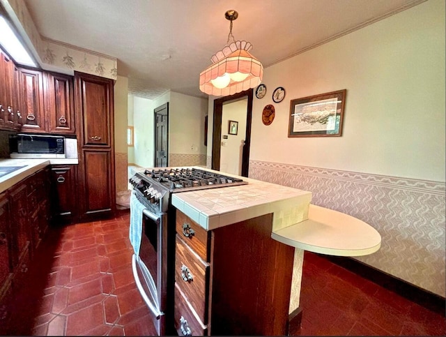 5401 Plantation Rd, Sunbury, OH 43074 - kitchen featuring stainless steel appliances, wallpapered walls, a wainscoted wall, and tile countertops