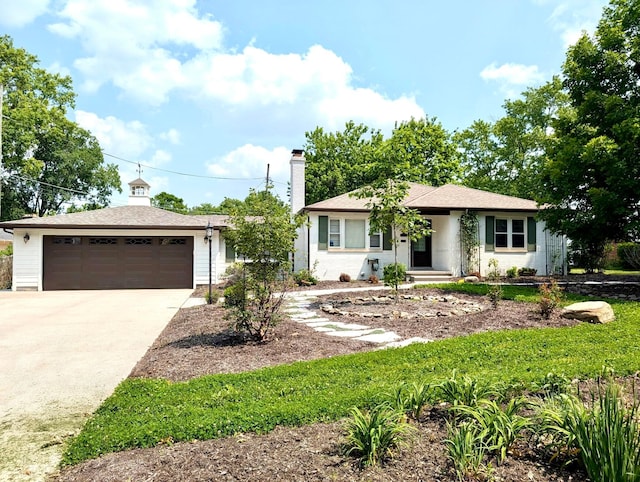 410 Acton Rd, Columbus, OH 43214 - ranch-style house featuring a chimney and driveway