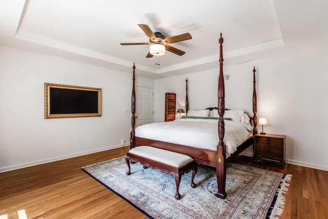 410 Acton Rd, Columbus, OH 43214 - bedroom featuring a raised ceiling, wood finished floors, and ceiling fan