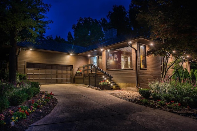 5769 Royal Lytham Ct, Dublin, OH 43017 - modern home featuring concrete driveway, an attached garage, and a chimney