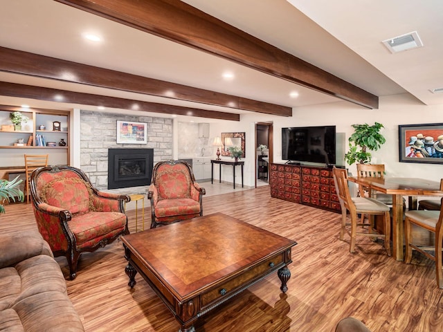 5769 Royal Lytham Ct, Dublin, OH 43017 - living room with a fireplace, light wood-style flooring, recessed lighting, and beam ceiling