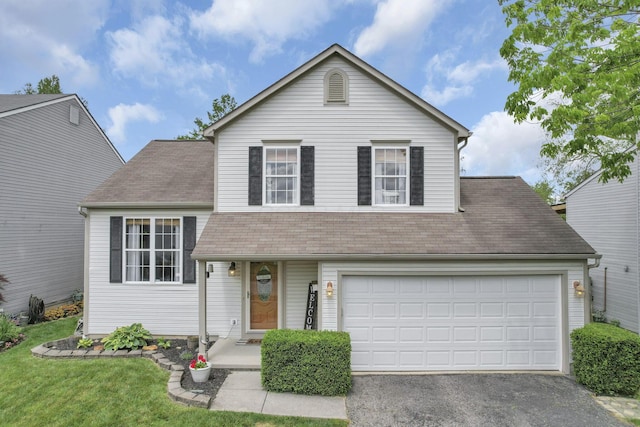 840 Gulliver Dr, Columbus, OH 43207 - view of front of property with asphalt driveway, a garage, and roof with shingles