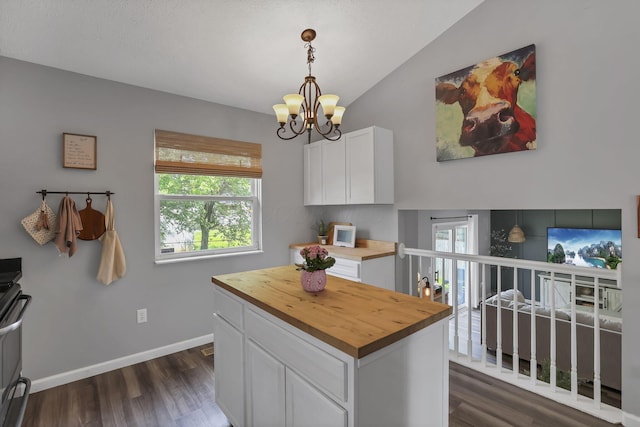 840 Gulliver Dr, Columbus, OH 43207 - kitchen featuring wood counters, a chandelier, white cabinetry, healthy amount of natural light, and lofted ceiling