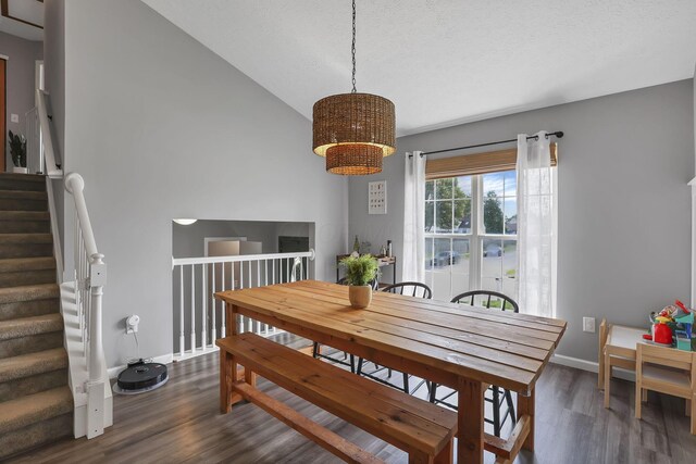 840 Gulliver Dr, Columbus, OH 43207 - dining space with dark wood-type flooring, a chandelier, baseboards, and stairway