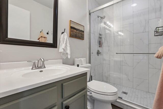840 Gulliver Dr, Columbus, OH 43207 - bathroom featuring toilet, vanity, and a stall shower