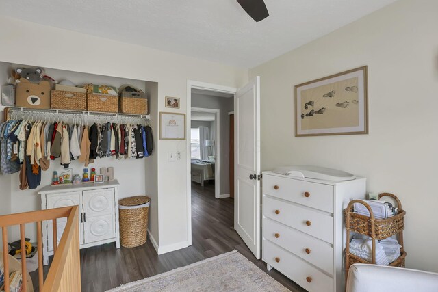 840 Gulliver Dr, Columbus, OH 43207 - bedroom with dark wood-style floors, a closet, baseboards, and ceiling fan