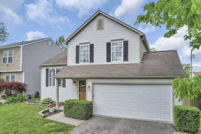 840 Gulliver Dr, Columbus, OH 43207 - view of front of property with driveway, a front yard, a garage, and a shingled roof
