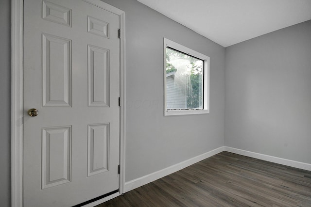 2732 Baughman Ave, Columbus, OH 43211 - unfurnished bedroom featuring baseboards and dark wood-style flooring