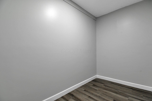 2732 Baughman Ave, Columbus, OH 43211 - spare room featuring dark wood finished floors and baseboards