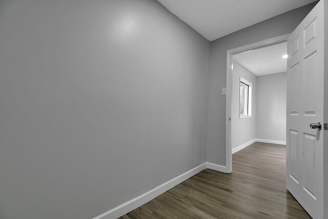 2732 Baughman Ave, Columbus, OH 43211 - corridor featuring baseboards and dark wood-type flooring