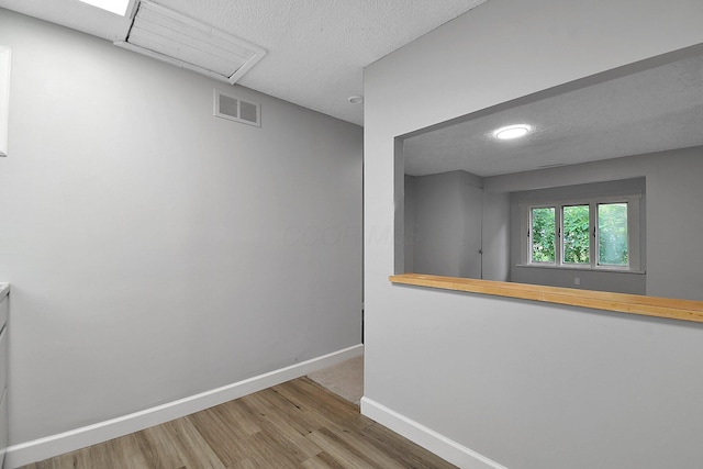 2732 Baughman Ave, Columbus, OH 43211 - empty room featuring wood finished floors, a textured ceiling, and recessed lighting