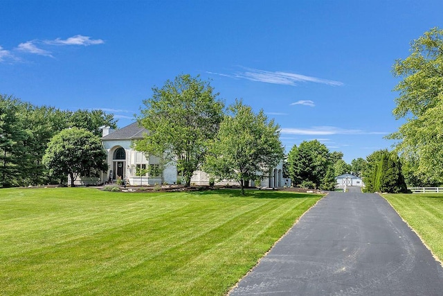 2570 Jewett Rd, Powell, OH 43065 - view of front of home with a front yard and a chimney