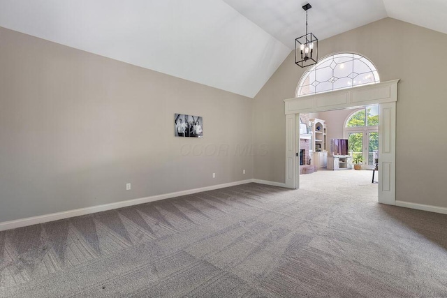 2570 Jewett Rd, Powell, OH 43065 - carpeted entrance foyer featuring high vaulted ceiling and a chandelier