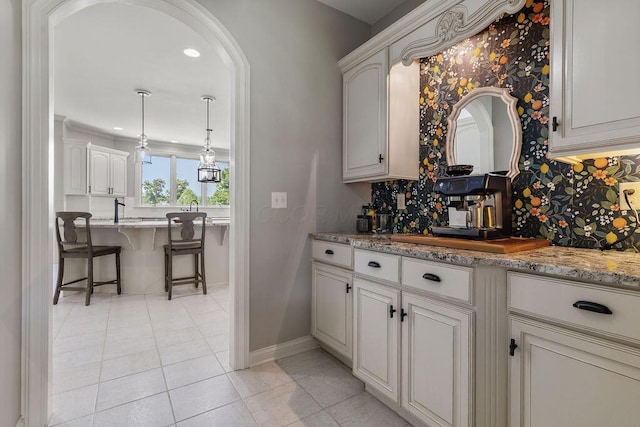 2570 Jewett Rd, Powell, OH 43065 - bar with decorative backsplash, arched walkways, light tile patterned flooring, and recessed lighting