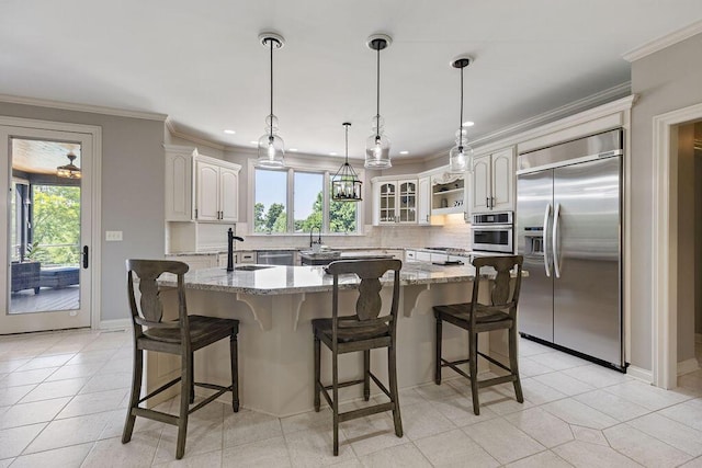 2570 Jewett Rd, Powell, OH 43065 - kitchen with appliances with stainless steel finishes, decorative backsplash, light stone countertops, ornamental molding, and a kitchen breakfast bar