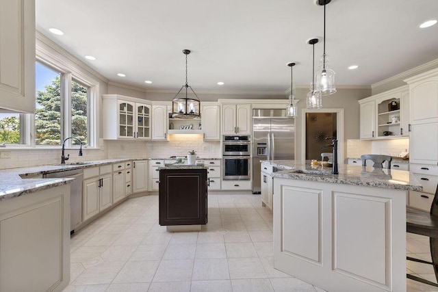 2570 Jewett Rd, Powell, OH 43065 - kitchen featuring a center island with sink, open shelves, stainless steel appliances, crown molding, and recessed lighting
