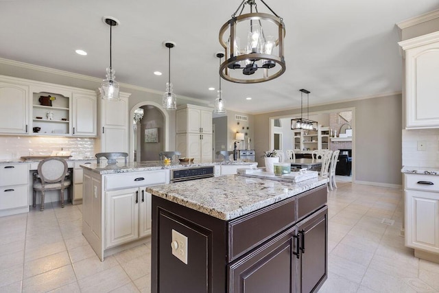 2570 Jewett Rd, Powell, OH 43065 - kitchen featuring a kitchen island, backsplash, light tile patterned floors, crown molding, and recessed lighting