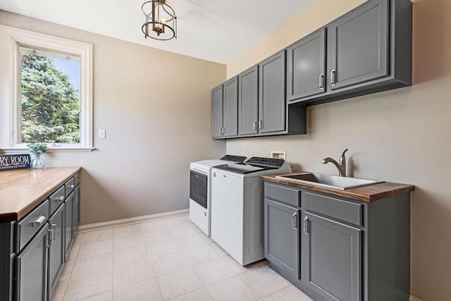 2570 Jewett Rd, Powell, OH 43065 - laundry room featuring cabinet space and separate washer and dryer