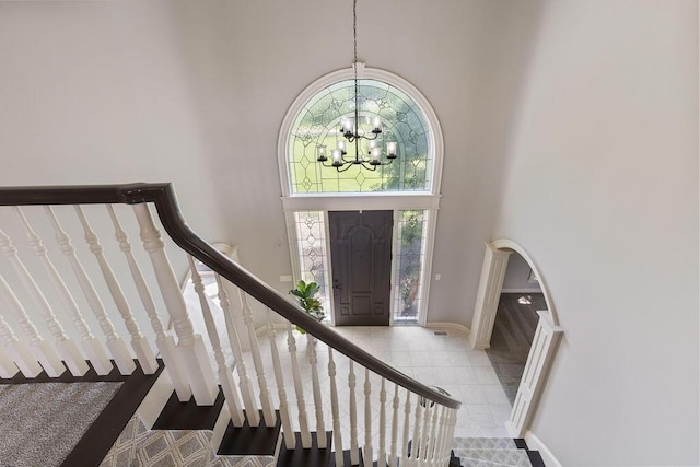 2570 Jewett Rd, Powell, OH 43065 - tiled entrance foyer with a high ceiling, a chandelier, and stairway