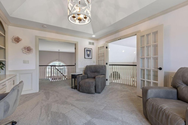 2570 Jewett Rd, Powell, OH 43065 - living area with a chandelier, carpet flooring, a wainscoted wall, vaulted ceiling, and an upstairs landing