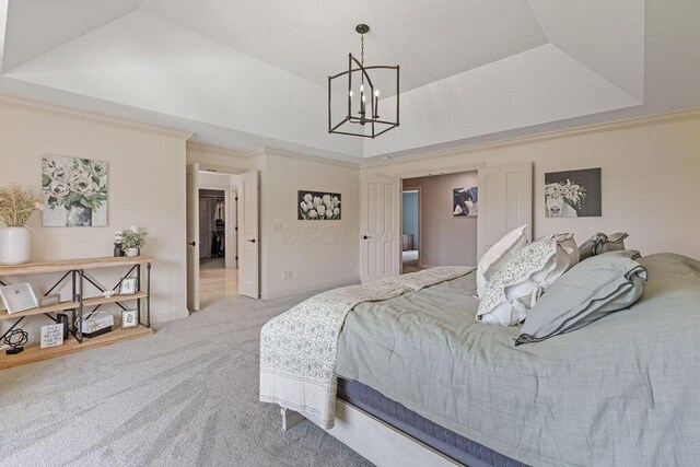 2570 Jewett Rd, Powell, OH 43065 - bedroom featuring carpet flooring, a chandelier, a tray ceiling, and ornamental molding