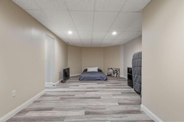 2570 Jewett Rd, Powell, OH 43065 - unfurnished bedroom with a drop ceiling, wood finished floors, and recessed lighting