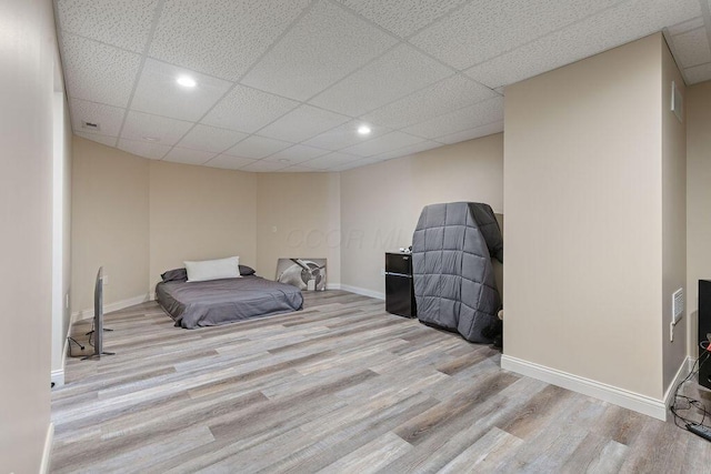 2570 Jewett Rd, Powell, OH 43065 - unfurnished bedroom featuring wood finished floors, a paneled ceiling, and recessed lighting