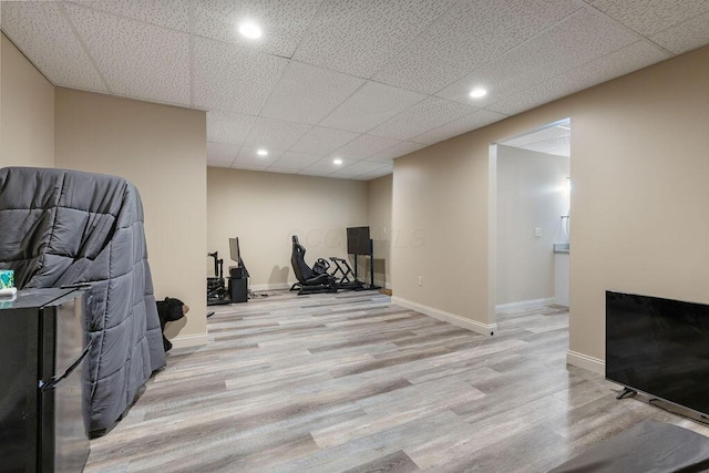 2570 Jewett Rd, Powell, OH 43065 - workout room with light wood finished floors, recessed lighting, and a drop ceiling