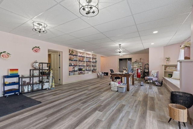 2570 Jewett Rd, Powell, OH 43065 - misc room featuring built in features, wood finished floors, a chandelier, a paneled ceiling, and recessed lighting