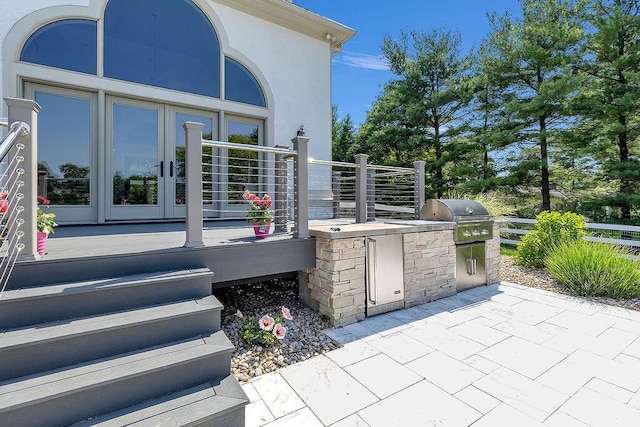 2570 Jewett Rd, Powell, OH 43065 - view of patio with area for grilling and a deck
