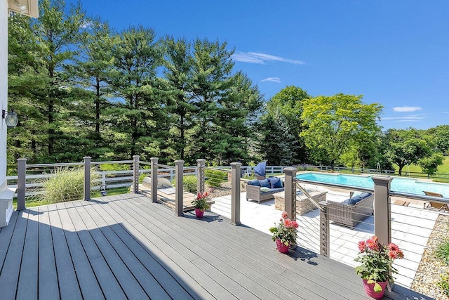2570 Jewett Rd, Powell, OH 43065 - wooden deck with an outdoor pool, outdoor lounge area, and view of wooded area