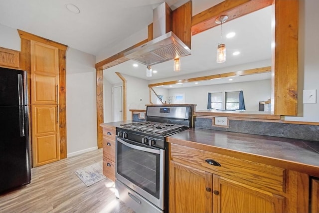 926 Harmon Ave, Columbus, OH 43223 - kitchen featuring freestanding refrigerator, gas range, wall chimney range hood, dark countertops, and recessed lighting