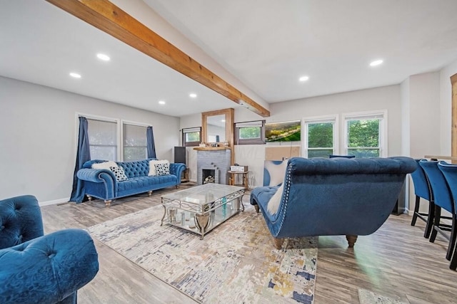 926 Harmon Ave, Columbus, OH 43223 - living room with recessed lighting, wood finished floors, beamed ceiling, baseboards, and a brick fireplace