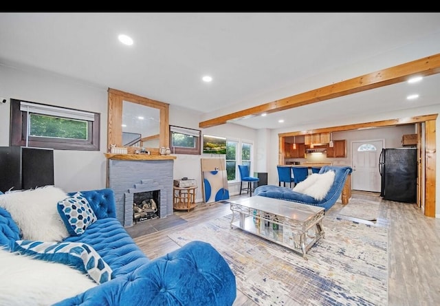 926 Harmon Ave, Columbus, OH 43223 - living room featuring beam ceiling, light wood-type flooring, recessed lighting, and a fireplace