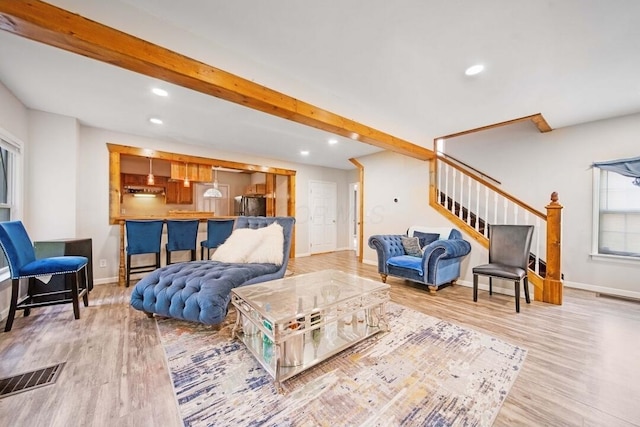 926 Harmon Ave, Columbus, OH 43223 - living area with stairway, wood finished floors, baseboards, recessed lighting, and beamed ceiling