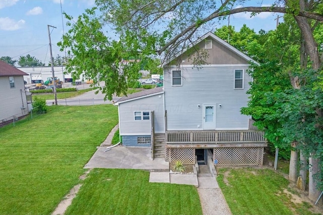 926 Harmon Ave, Columbus, OH 43223 - rear view of property featuring a patio, a lawn, and a wooden deck